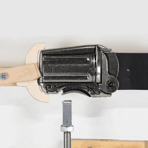 product testing machine pushes trigger on gun belt buckle open and closed repeatedly