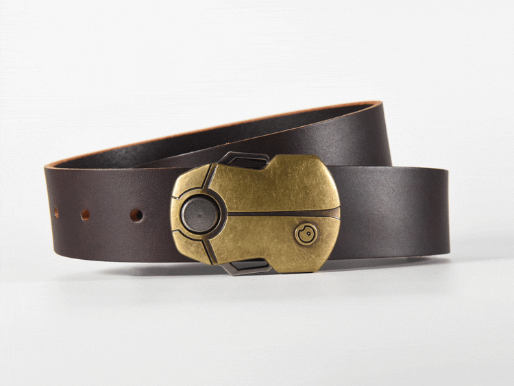 The magnetic beetle buckle opens by pushing the top wing down. The lock pivots open, releasing the buckle from the screw. The word OBSCURE is revealed on the lock's hook. Push the bottom button up to lock the buckle again.