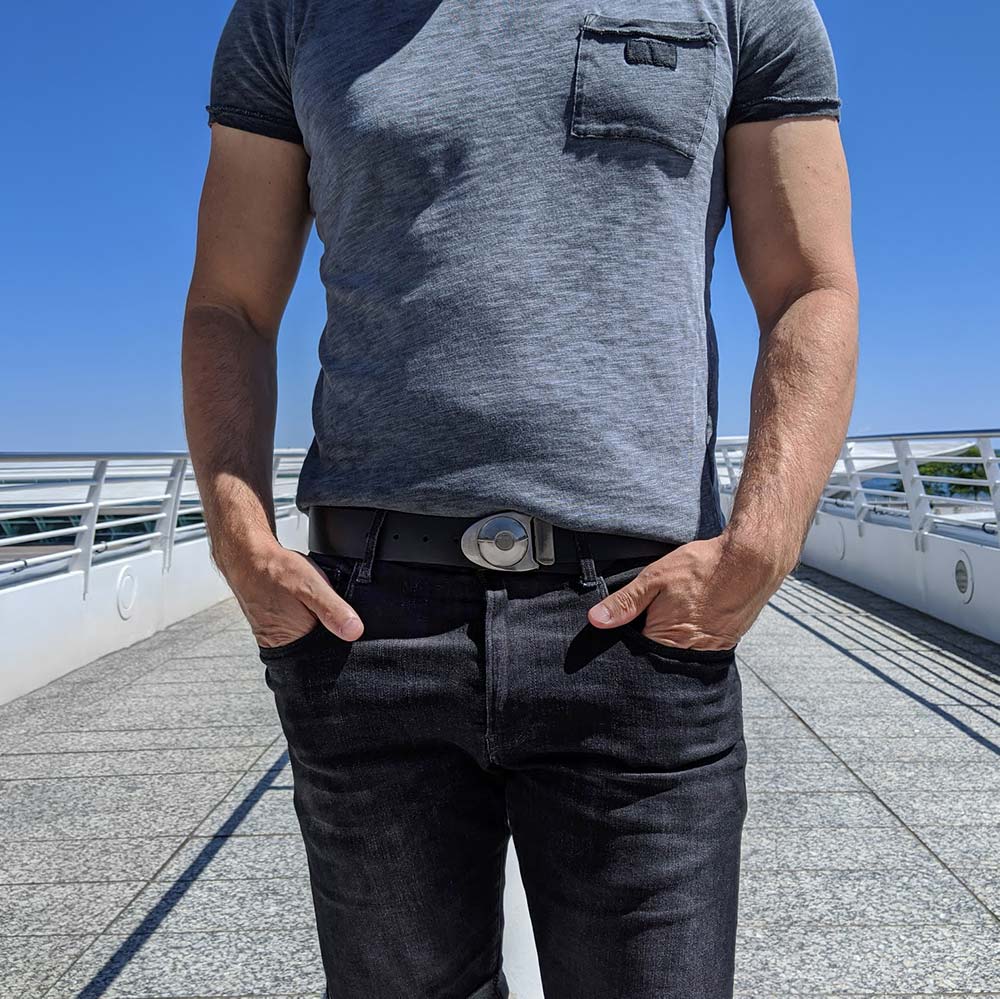 Man wearing modern mens leather work belt in the city. Wear our casual belts to work with dark denim jeans!