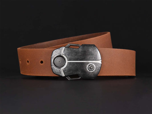 Light brown leather belt with a metallic buckle shaped like a Scarab Beetle on a black background